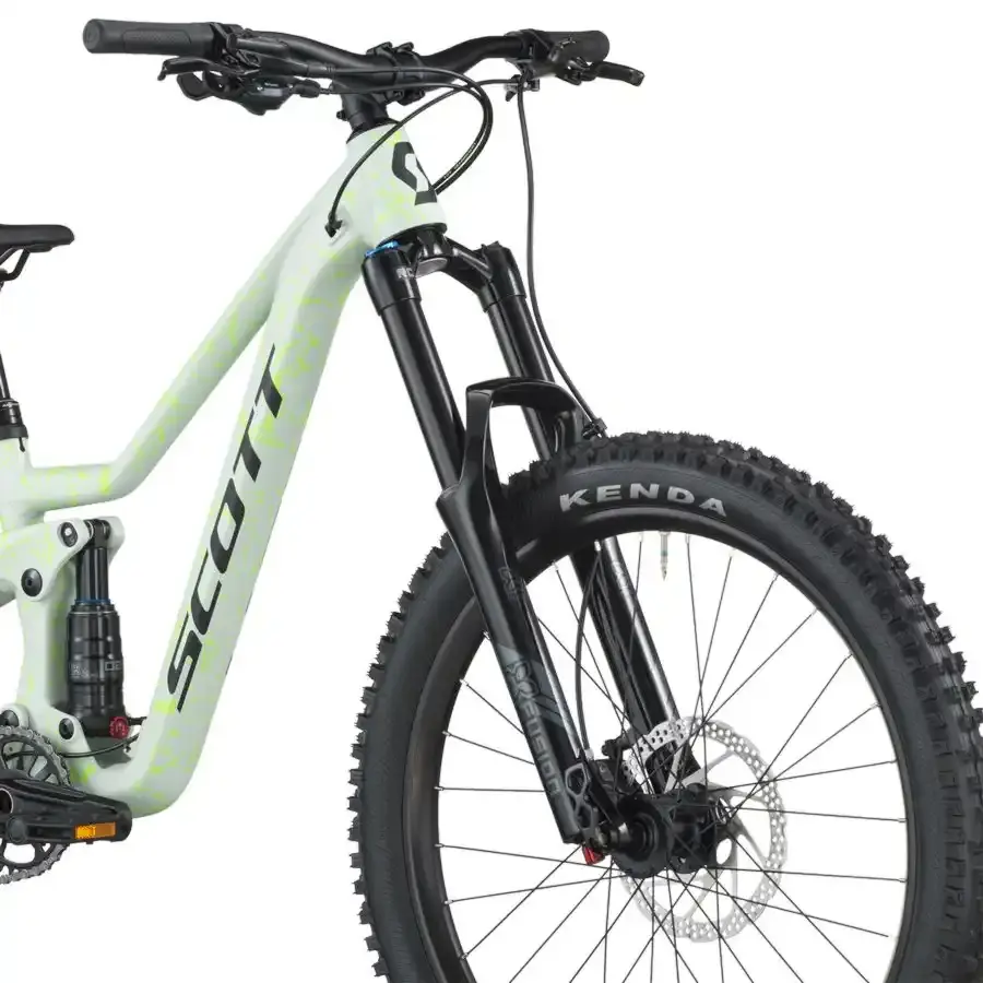 A Bicicleta SCOTT Ransom 400 tem rodas 24", uma suspensão ajustada a crianças (140 mm), um amortecedor (130 mm) e um botão para controlar a suspensão.