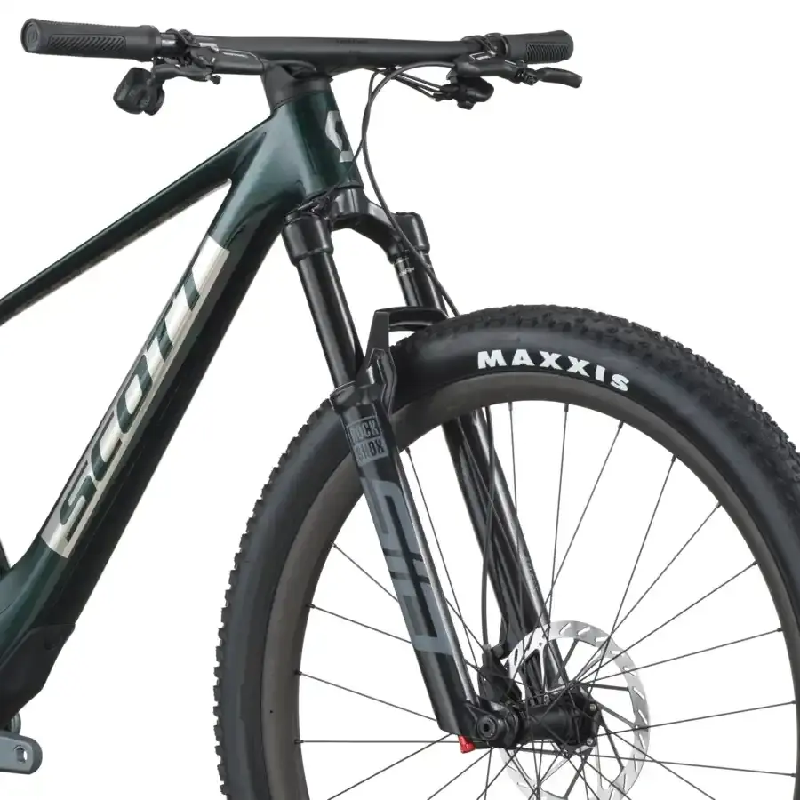 A Bicicleta SCOTT Spark RC Team Issue tem RockShox SID Select 3P, Quadro em Carbono HMF e transmissão SRAM GX AXS 12 VL.